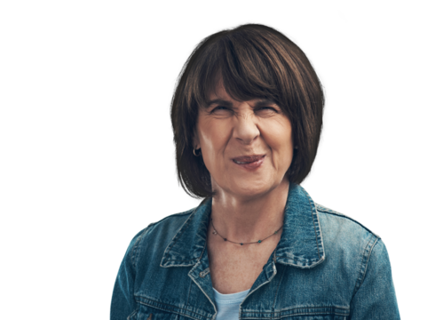 A senior woman frowning against a grey background Isolated on a PNG background.