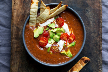 Tomato and red bean soup with avocado topping