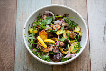 Vegan salad with roast chestnuts, mushrooms and potatoes