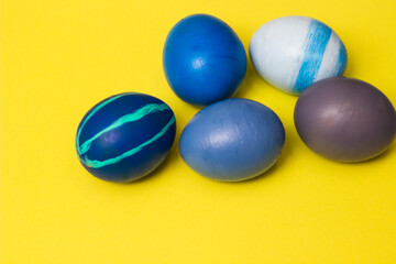 Blue Easter Eggs on yellow background