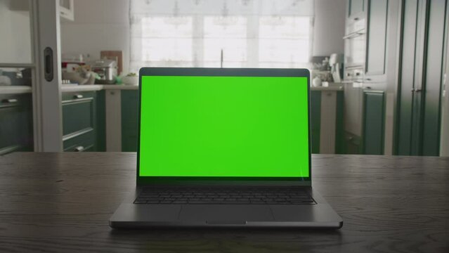 Zoom out from green screen laptop