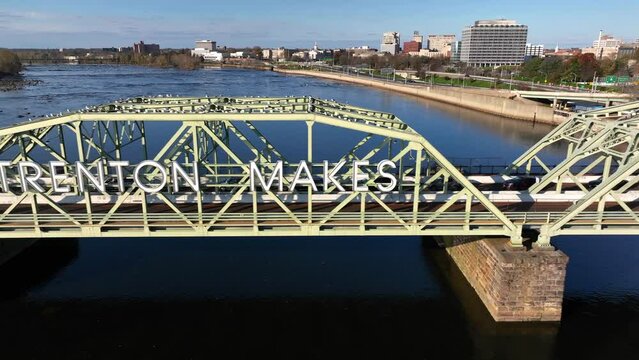 Trenton Makes The World Takes sign in New Jersey. Bridge over Delaware River. Aerial during day.