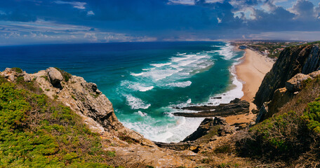 Amazing panoramic landscape of a picturesque atlantic coast with rocks and long beach of Praia...