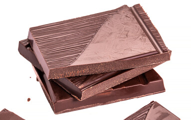 Close up pieces of chocolate on a white background, dessert isolated, cafe concept.