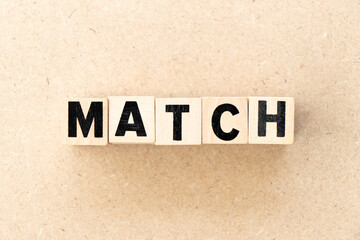Alphabet letter block in word match on wood background