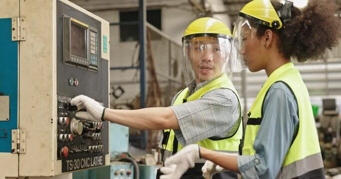 Machine technicians in a factory are checking electrical equipment and machines to be ready for use. working professionally. Concept Blue collar