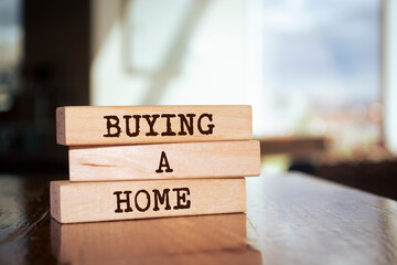 Wooden blocks with words 'Buying a Home'.