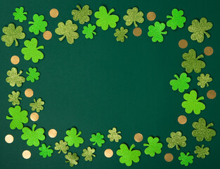 Golden Horseshoe, Gold Coins and Clover Leaves Shamrocks on Green Background.