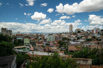 Fototapeta premium Amazing metropole with houses on small hills and horizon with mountains
