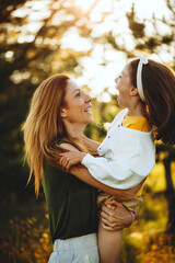 Mother and daughter laughing