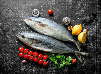 Raw fish with lemon, cherry tomatoes and parsley.