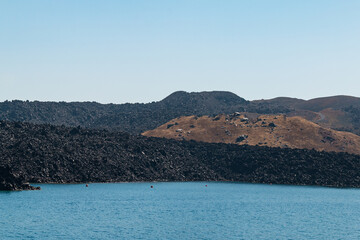 Therasia island in Santorini caldera - view from boat