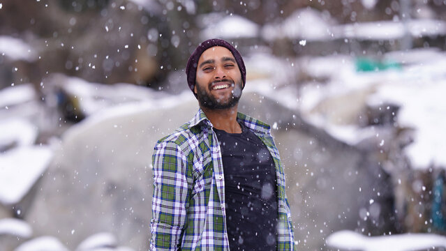 Indian boy with snow snowfall image