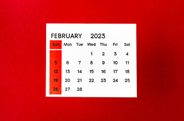 The February 2023 Monthly calendar for 2023 year on red background.