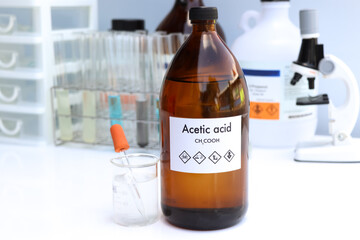 Acetic acid in bottle , chemical in the laboratory and industry