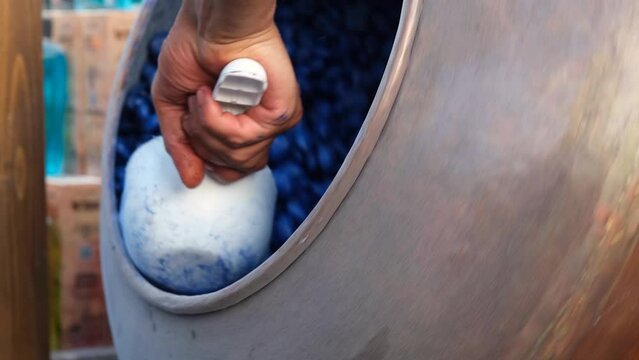 Blue Almond Candy. Giving the almond candy a blue color. Pouring hot blue sherbet.
