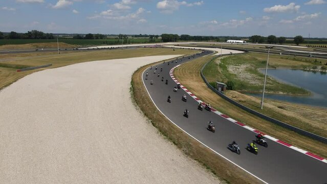 Cars and motorcycles on a racetrack