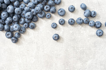 Raw Organic Blueberries on a gray background, side view. Copy space.