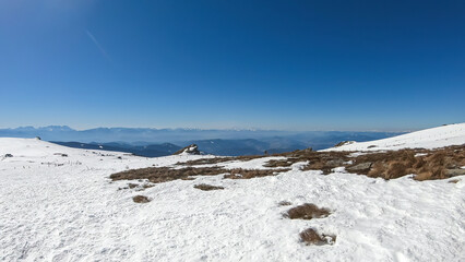Scenic view of snow covered alpine meadows and Koralpe mountains seen from Ladinger Spitz, Saualpe,...