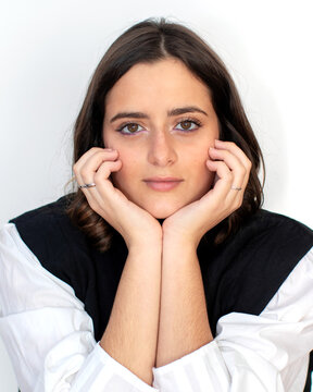 Positive Woman Touching Chin On White Background