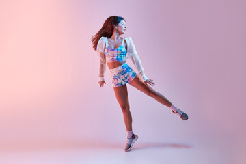 Fit woman dancing in studio