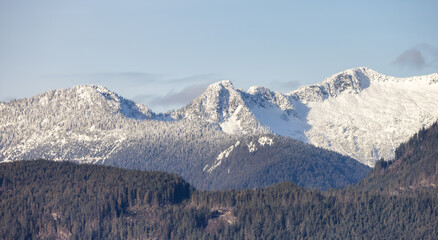 Fototapeta premium Canadian Mountain Landscape Nature Background. Sunny Winter Day. Howe Sound near Squamish, British Columbia, Canada.