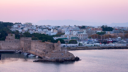 Fototapeta na wymiar City on the Mediterranean Sea, Rhodes, Greece. Sunset Twilight