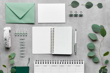 Knolling home office stationary. Study table overhead view. Envelope, postcard, pins, pegs, pen,...