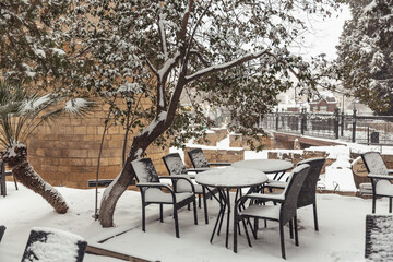 tables in cafes covered with snow
