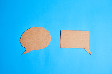 Square and circular dialogue bubbles made of cardboard, concept communication, togetherness,...
