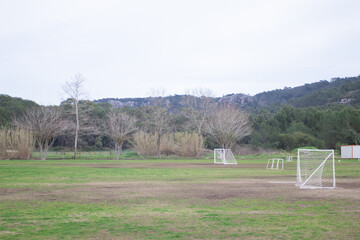 An empty city football field with a goal