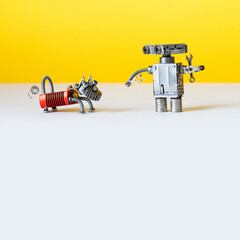 A robot and his dog. Mechanical toy characters, steam punk design. yellow grey background - 562750448