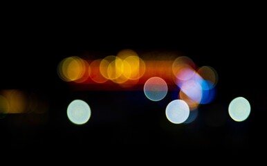 Fototapeta premium bokeh light background. Bokeh is a word with Japanese origins, defined as “the way the lens renders out-of-focus points of light.” The word comes from the Japanese word bokeh.