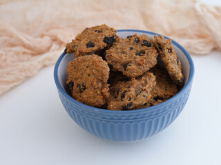 Homemade gluten-free oatmeal raisin cookies in a bowl
