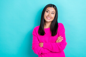 Portrait of young charming optimistic pretty korean lady crossed arms dreamy look empty space new brand shop isolated on aquamarine color background