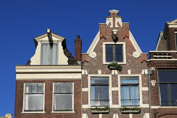 Amsterdam Bloemgracht Canal House Facades Close Up with Bright Blue Sky, Netherlands