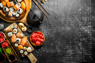 An assortment of different types of sushi and rolls.