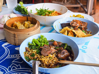 Stewed Pork Noodles Longan juice soup ,Northern style curried noodle soup with chicken  and Pork Dumplings set