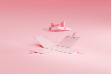 Unwrapped an opened gift box in pink valentine like colors. Side fall open, lid with bow ribbon still hovering above. Product placement template.