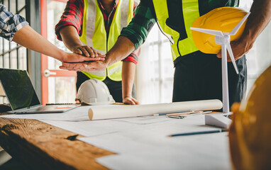 engineering team shaking hands start planning for architecture Engineer sketching construction project concept with architect equipment Consult about their construction project.