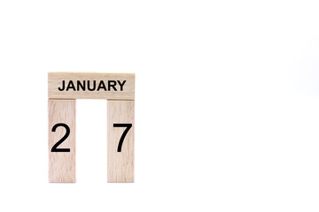 January 27 displayed wooden letter blocks on white background with space for print. Concept for...