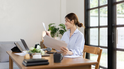 Work from home, College student is analyzing data or doing homework assignments in her house, Use your laptop to search for information and educate yourself at home, Stay home, Internet learning.