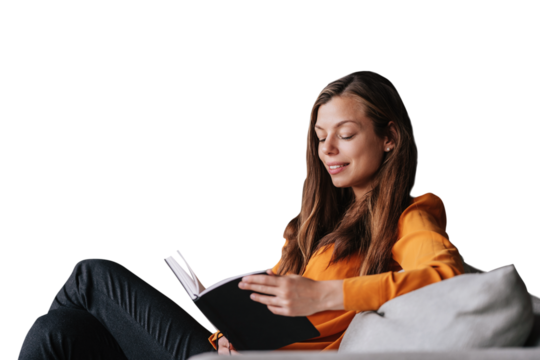 Young adult beautiful brunette woman in orange blouse holding book, relaxing home. Confident hispanic female psychologist looks at her diary, prepares for client. Girl against transparent background.