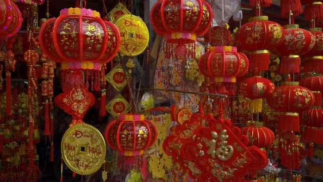 Red Chinese flashlight during the day. New Year's Fair with Chinese red lanterns and decorations. TET holiday in Vietnam. Chinese New Year. 