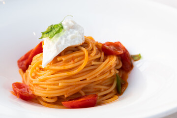 Italian pasta - spaghetti with mozzarella cheese closeup, mediterranean diet.