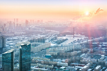 Fototapeta premium View of the city from the observation deck on skyscrapers in the setting sun, Poklonnaya Gora and Victory Park, Moscow City