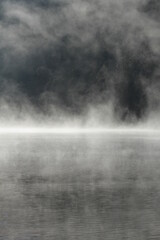 Misty nature background of mountain lake