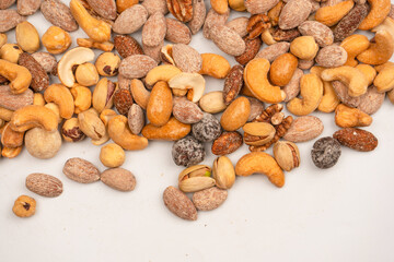 A group of almonds, pistachios, walnuts, macadamia, cashews.