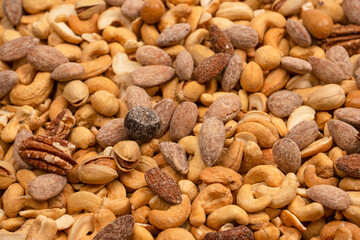 A group of almonds, pistachios, walnuts, macadamia, cashews.