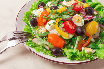 Vegetable salad , with quail eggs and olives, fresh, close-up, no people,